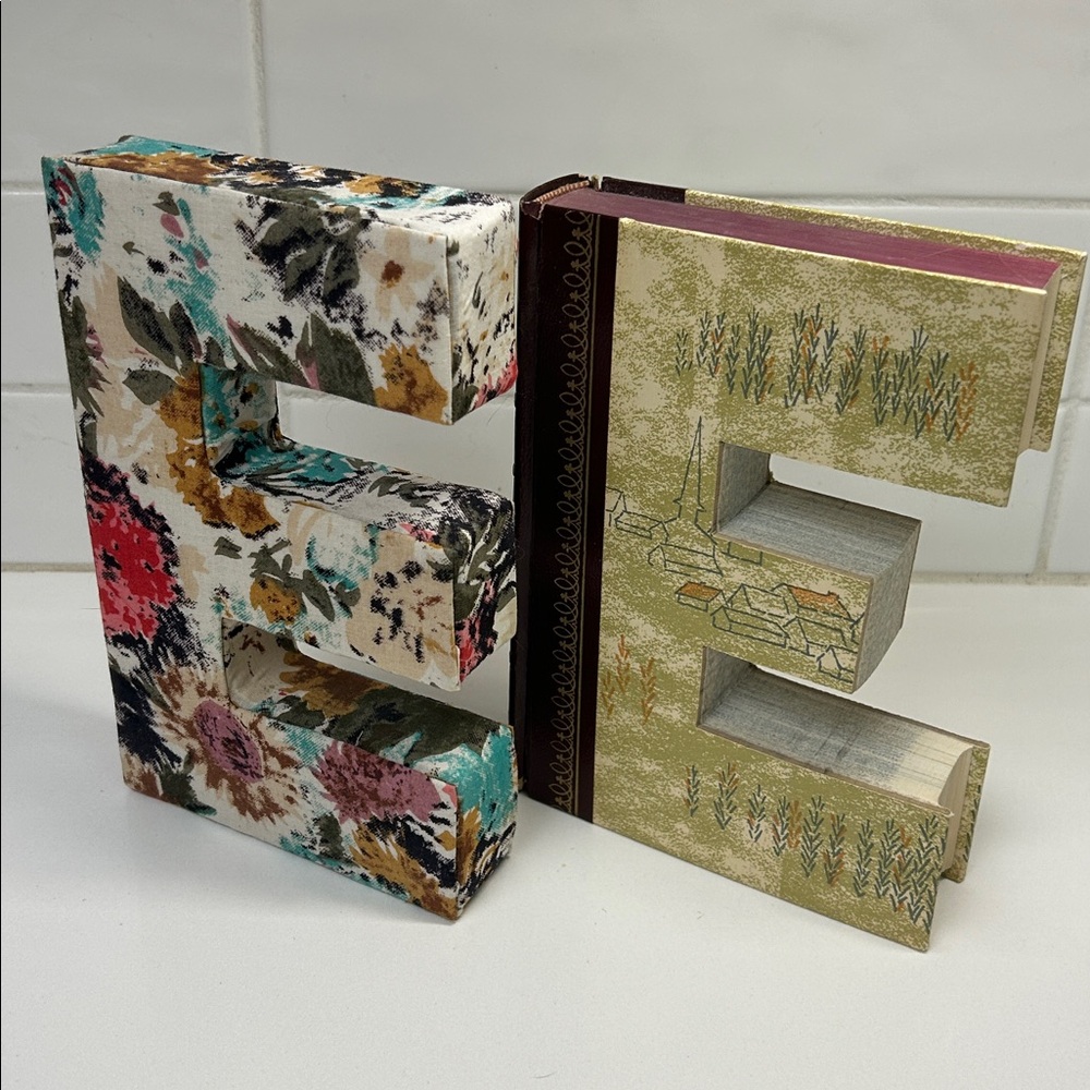 Anthropologie: 2 book and fabric letter Es. 7.5” tall.